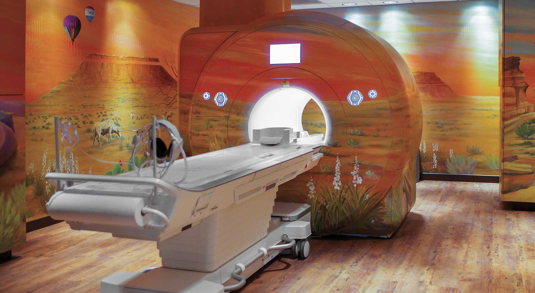 An MRI installation with murals of Southwestern scenery on the walls